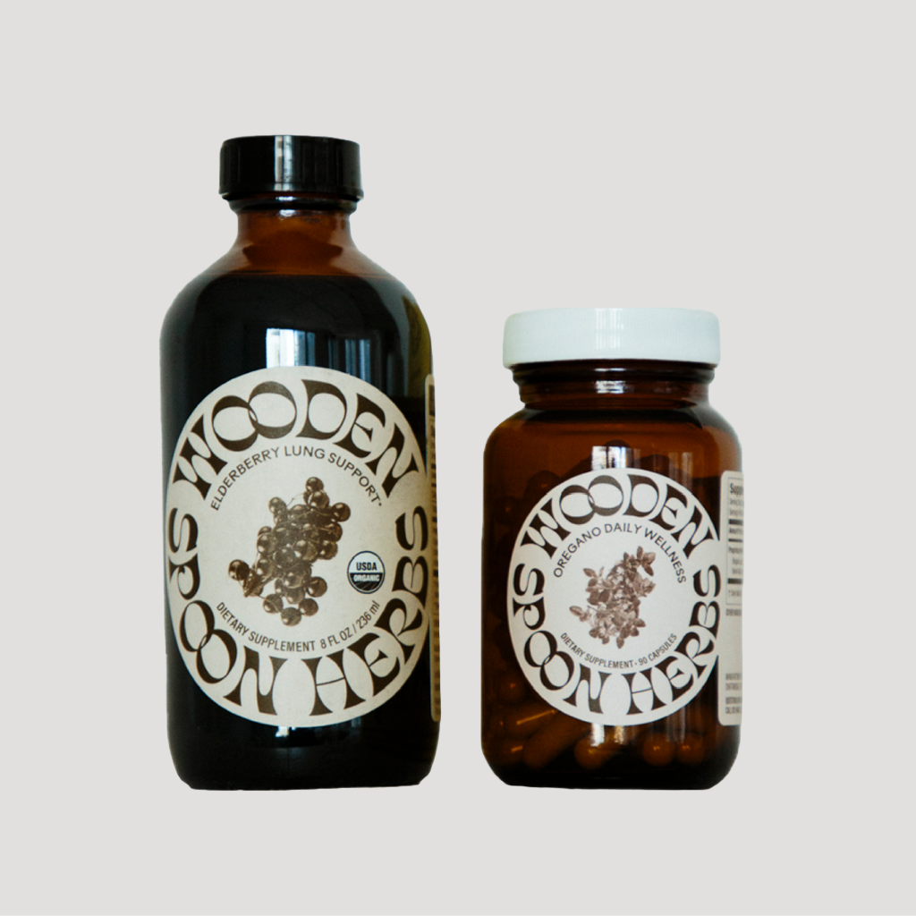Two bottles of Wooden Spoon Herbs on a light gray background