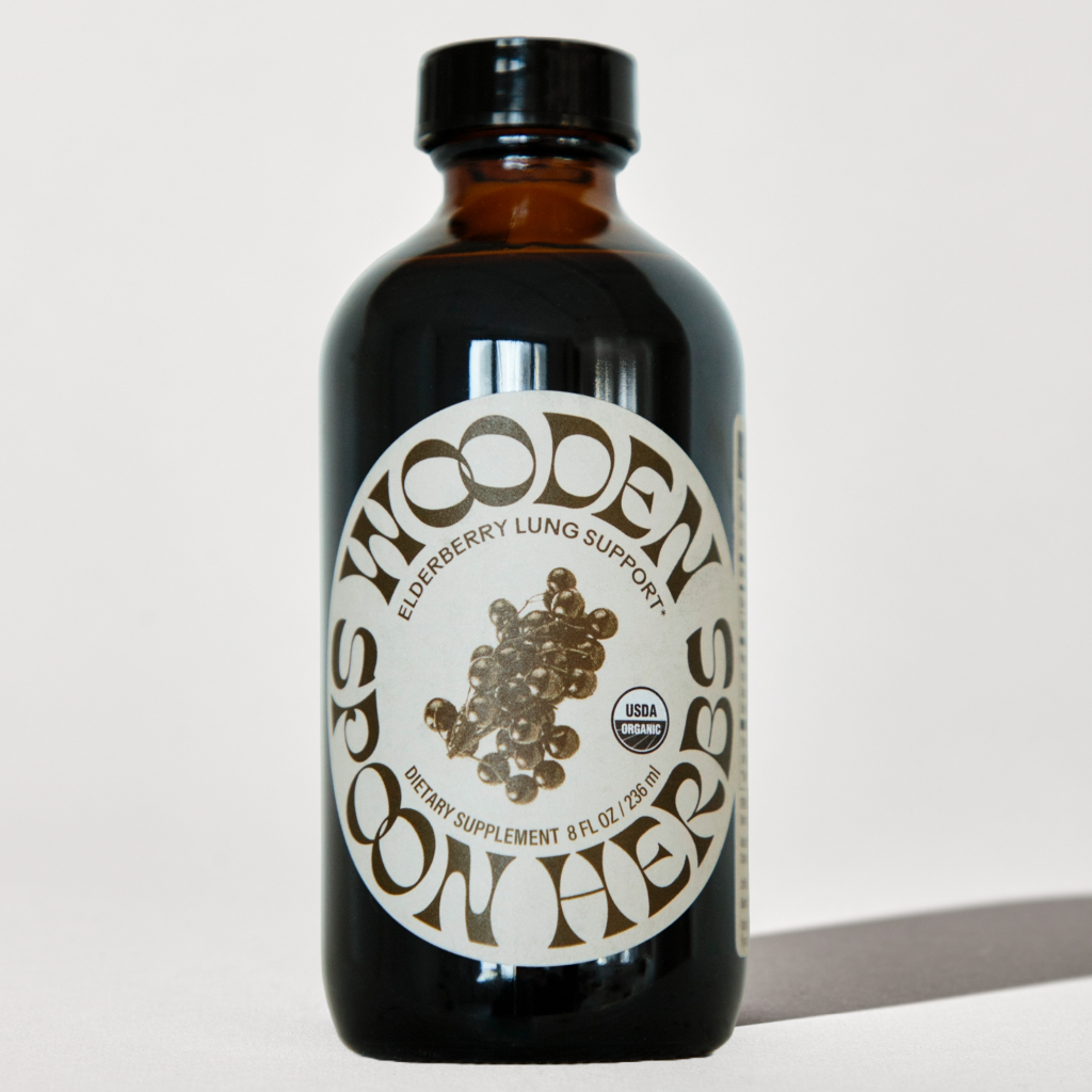 Elderberry bottle with a label on a white background