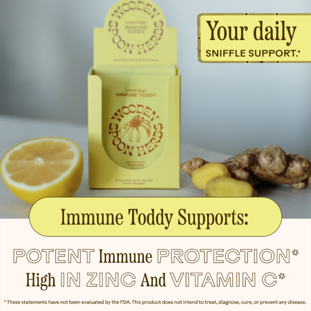 Box of 'Wooden Spoon Herbs' immune support product with lemon, ginger, and text about immune support.