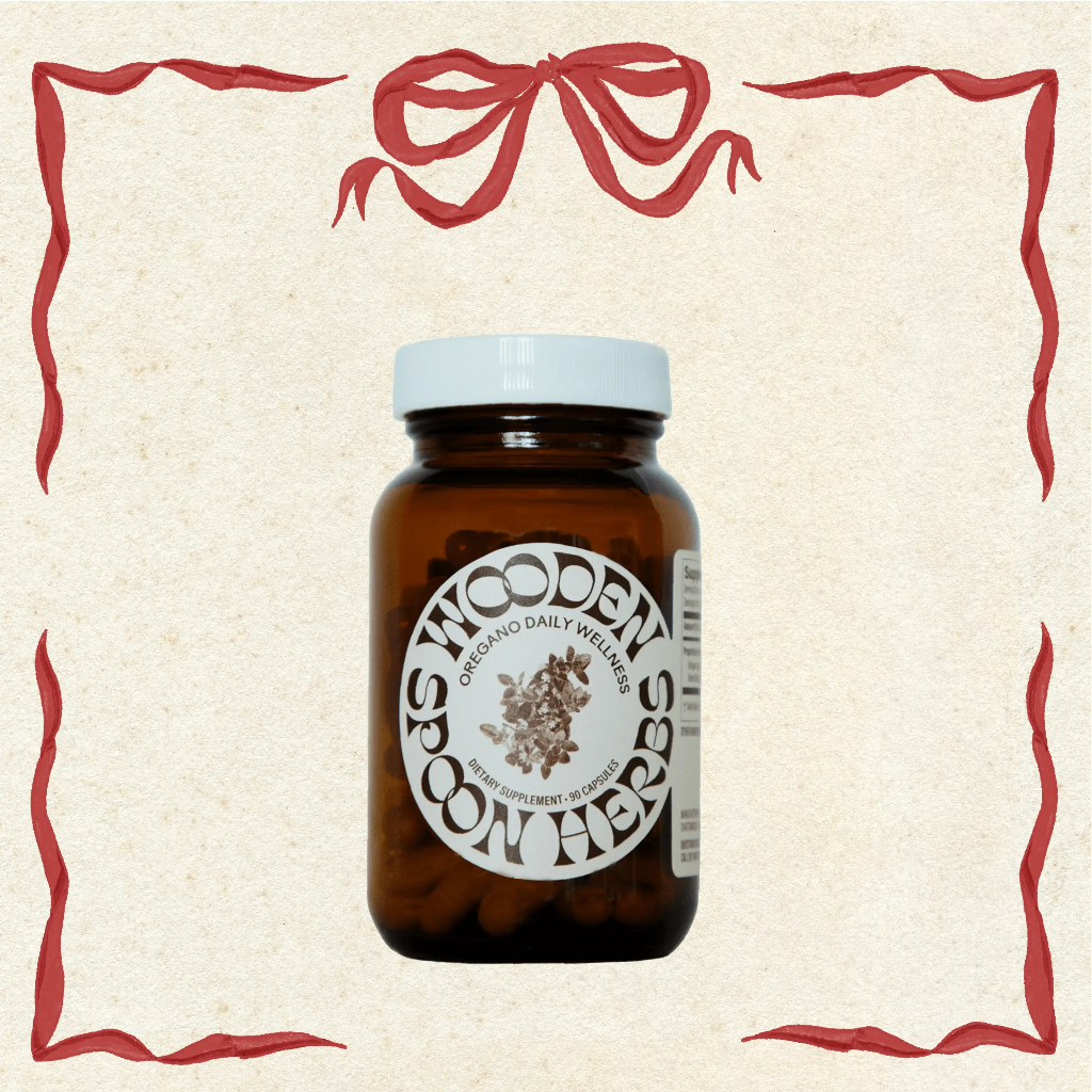 Brown jar with white cap and label on a beige background with decorative red border