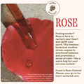 Red rose petal with a dropper of liquid and text about rose's benefits.