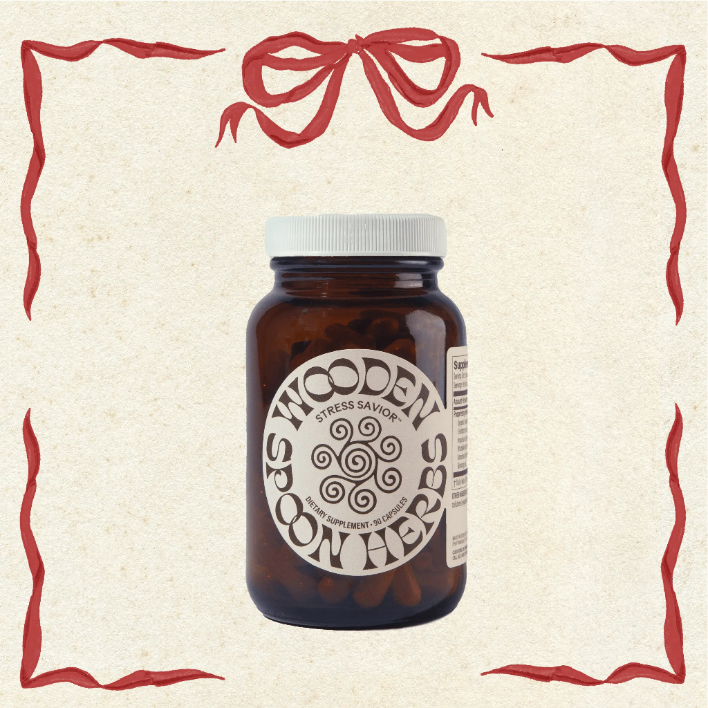 Brown supplement bottle with white label on a beige background with decorative red border