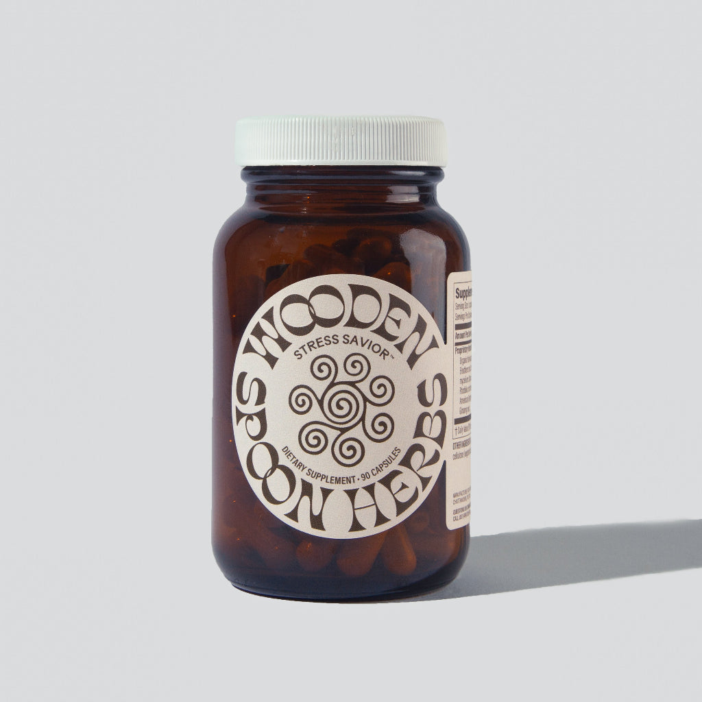 A bottle of Stress Savior supplements from Wooden Spoon Herbs on a white background.