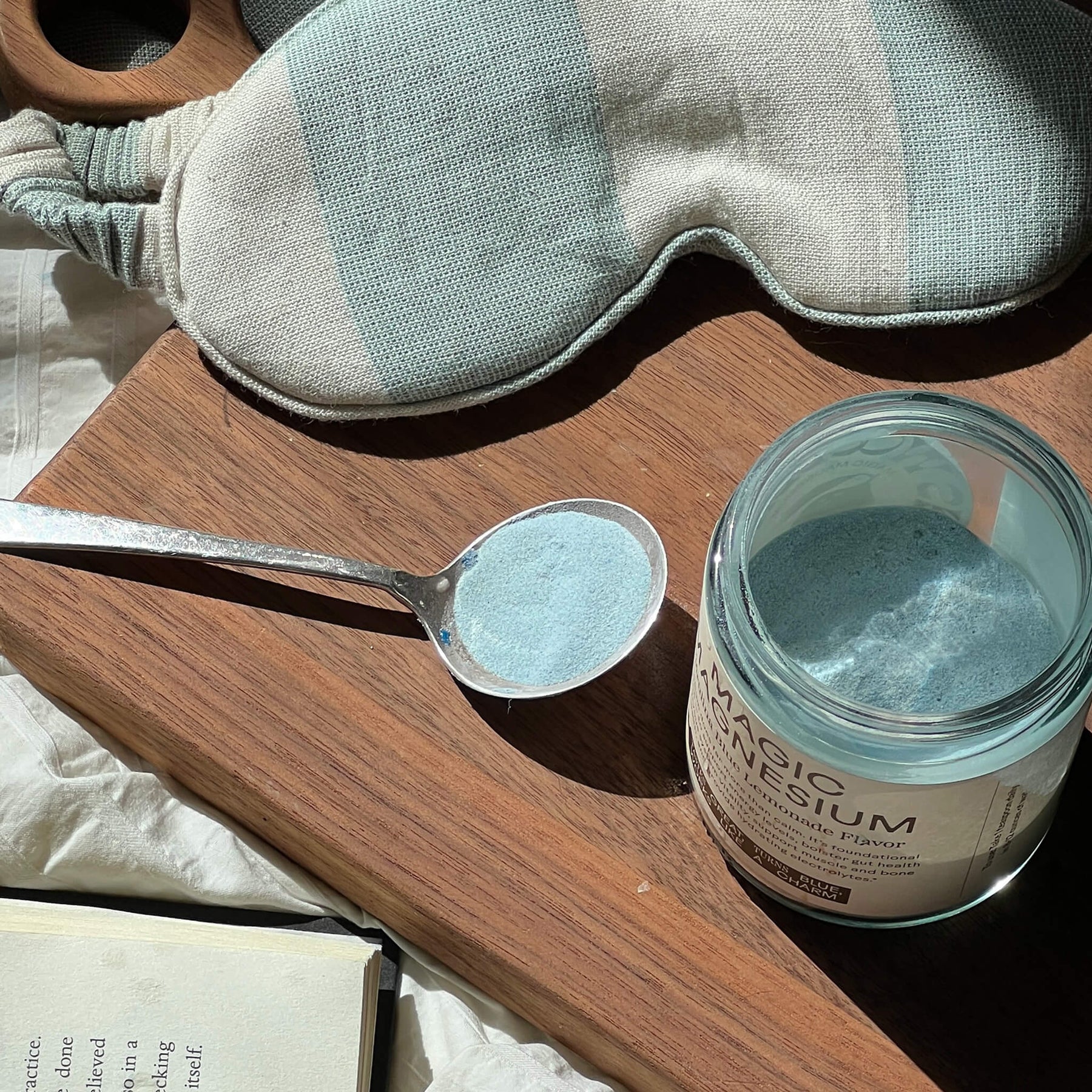 Open jar and spoon of Wooden Spoon Herbs Magic Magnesium Blue Spirulina Lemonade powder
