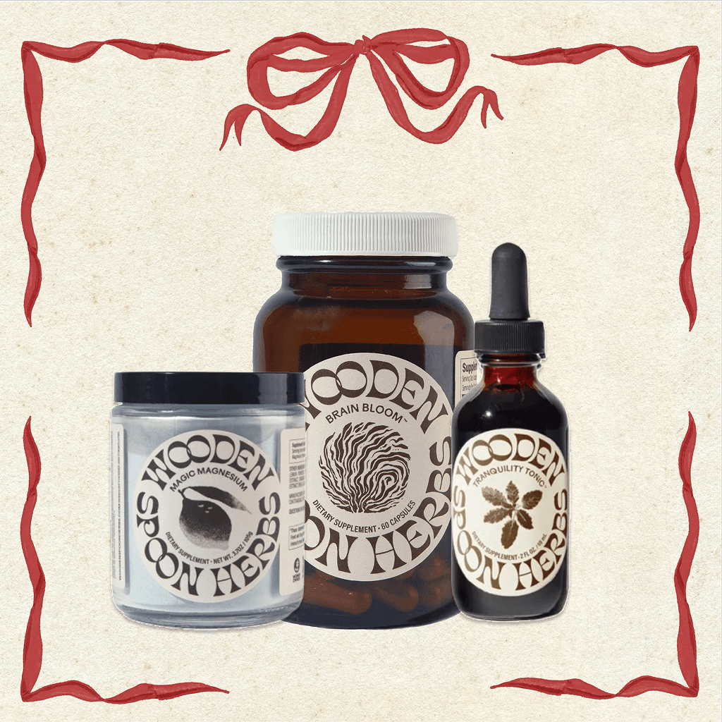 Collection of Wooden Spoon Herbs products including a jar, bottle, and dropper on a decorative background.